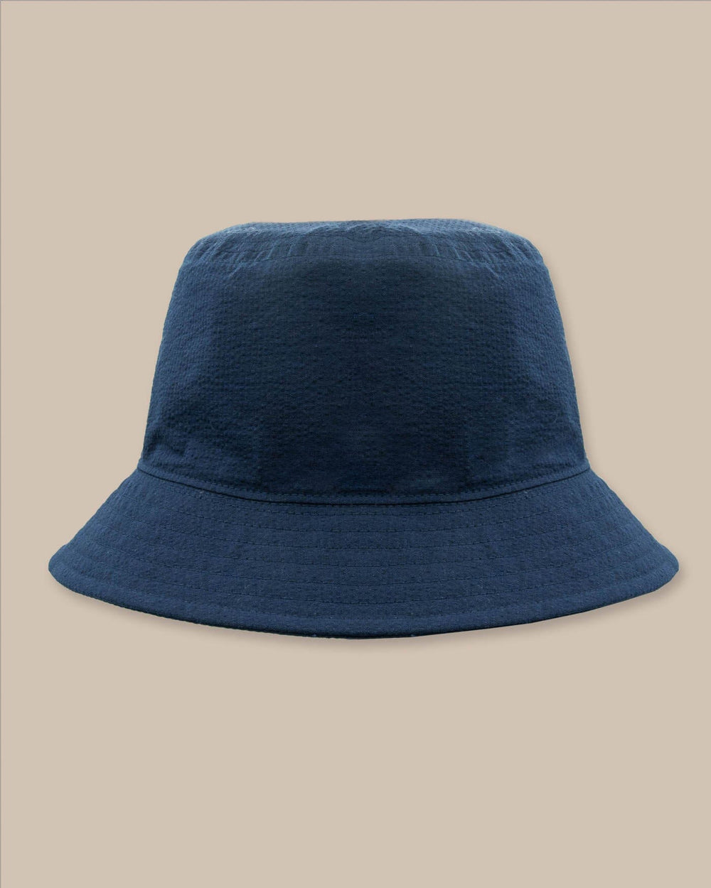 The back view of the Southern Tide Sun Washed Seersucker Bucket Hat by Southern Tide - Navy