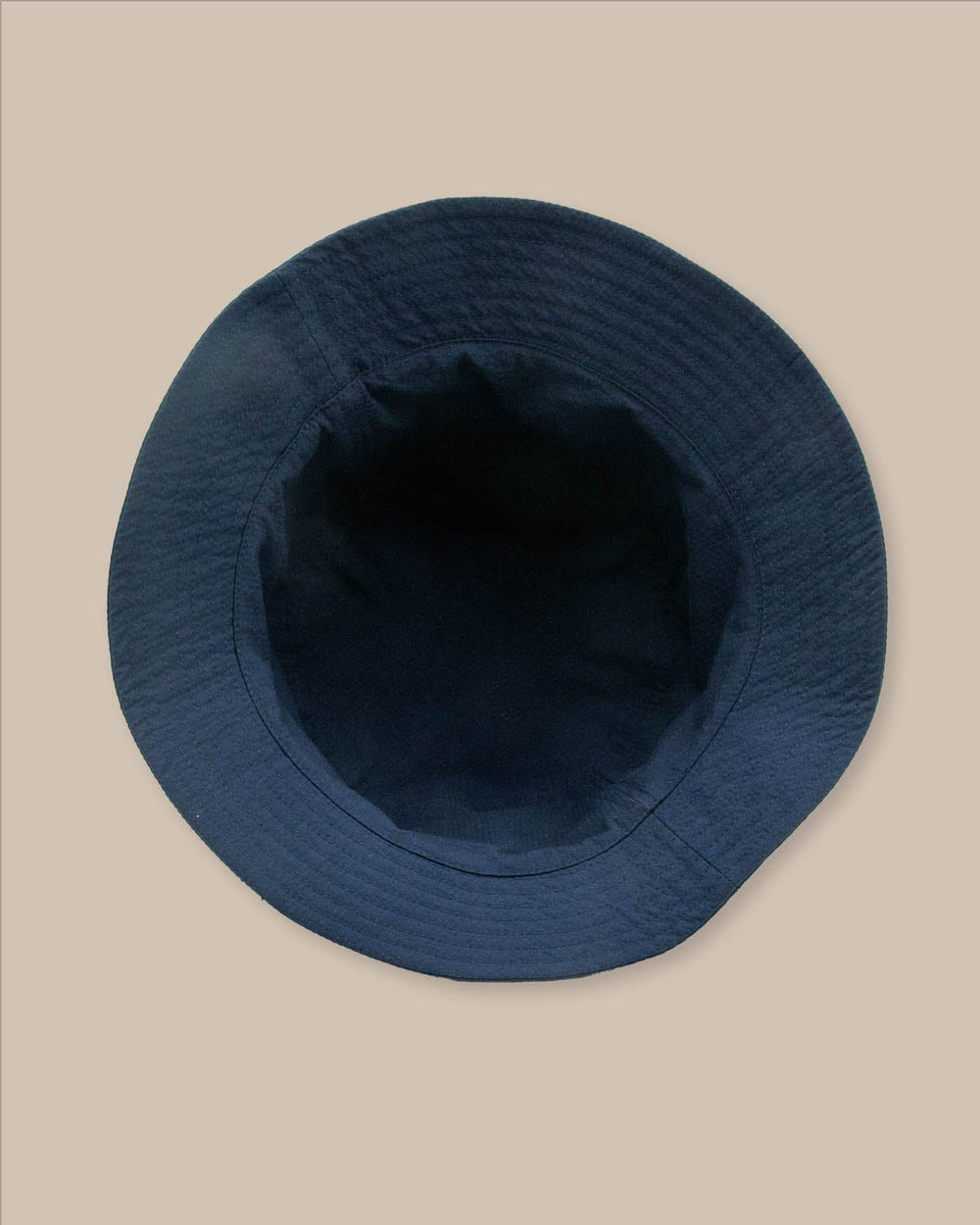The detail view of the Southern Tide Sun Washed Seersucker Bucket Hat by Southern Tide - Navy 