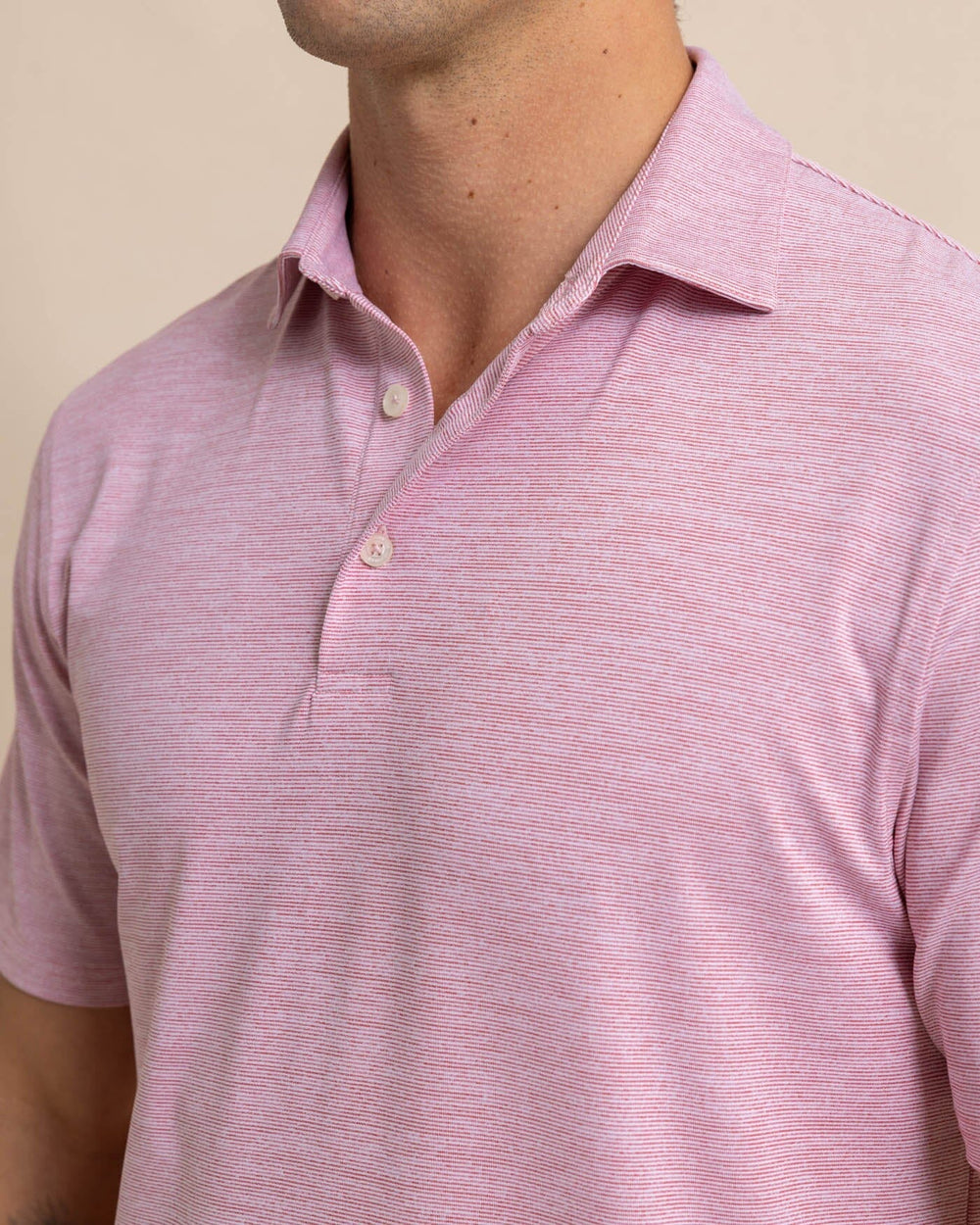 The detail view of the Southern Tide Team Colors Driver Spacedye Polo Shirt by Southern Tide - Crimson