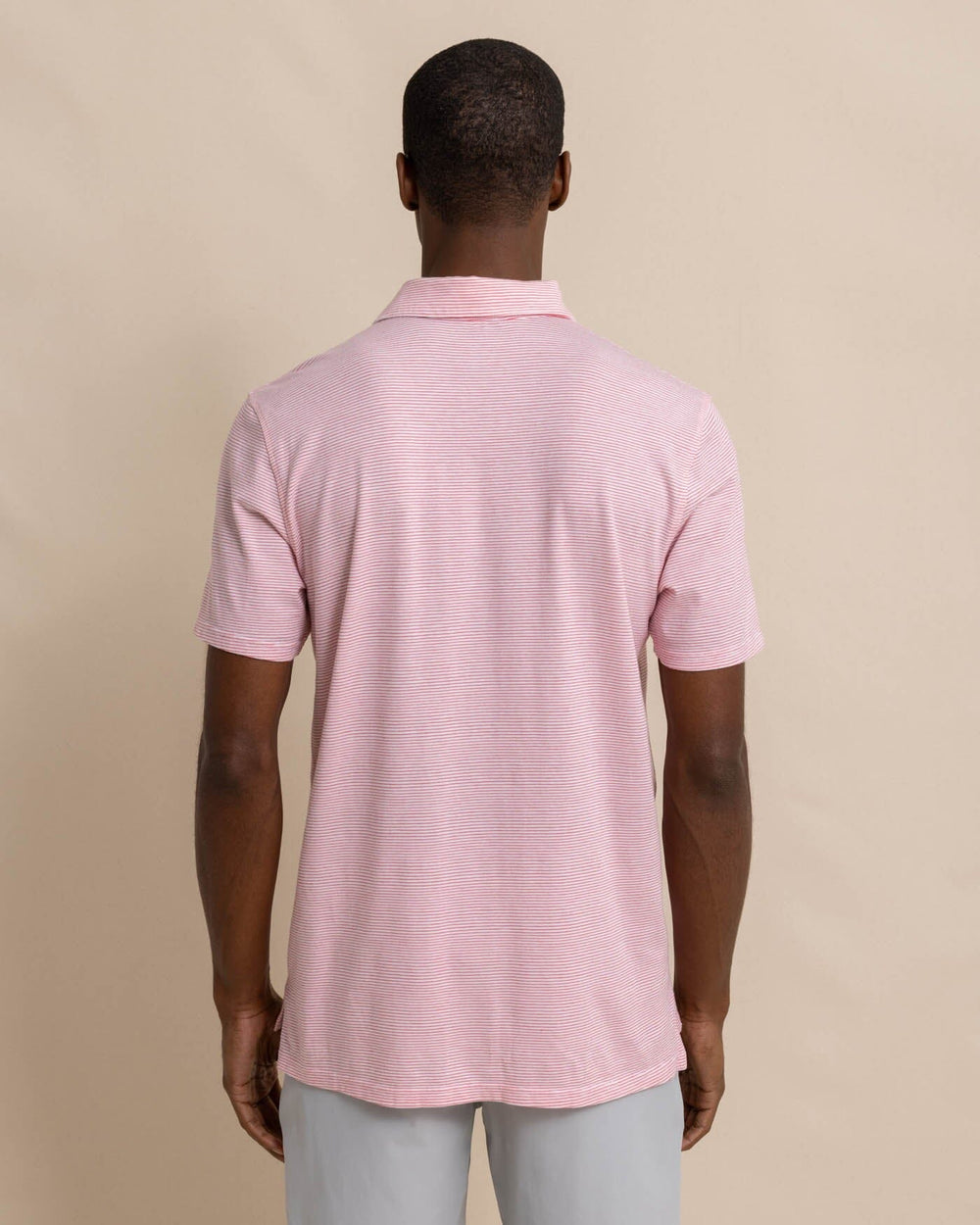The back view of the Southern Tide The Seaport Davenport Stripe Polo by Southern Tide - Teaberry Pink