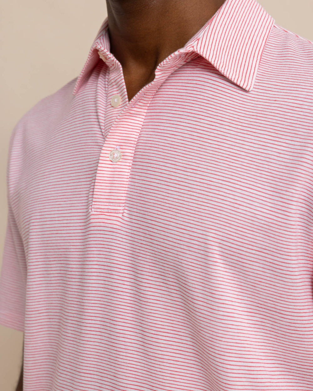 The detail view of the Southern Tide The Seaport Davenport Stripe Polo by Southern Tide - Teaberry Pink