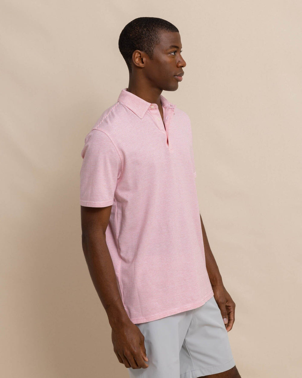 The front view of the Southern Tide The Seaport Davenport Stripe Polo by Southern Tide - Teaberry Pink