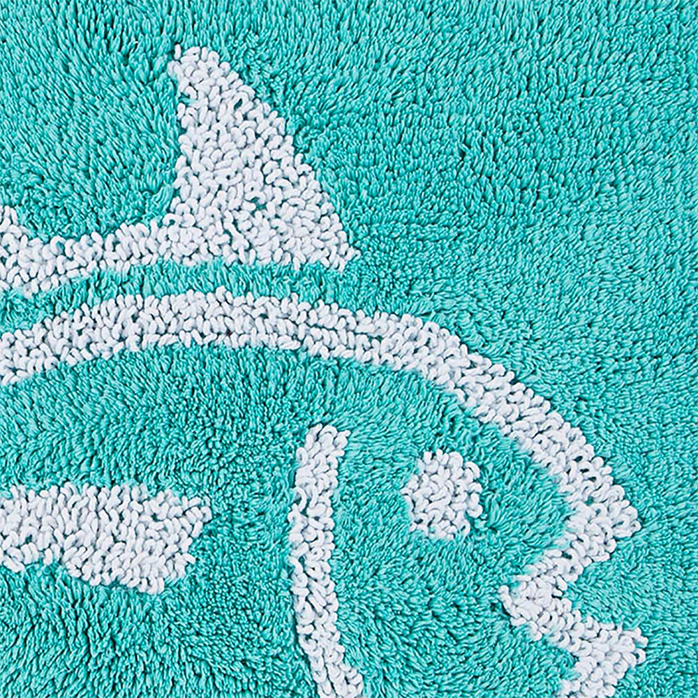 The detail view of the Reversible Skipjack Bath Rug by Southern Tide - Aqua
