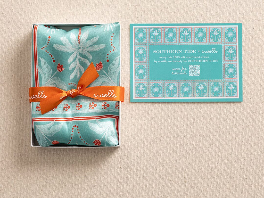 Italian silk scarf folded in a box.