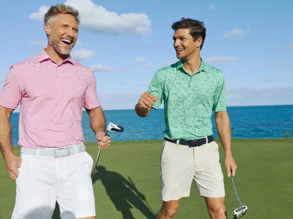 Man wearing Pink Skipjack Polo on the beach.