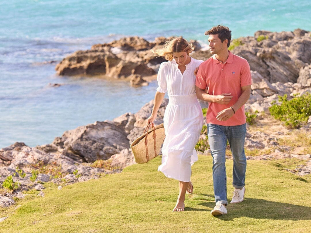 Woman siting on bench with two sons.