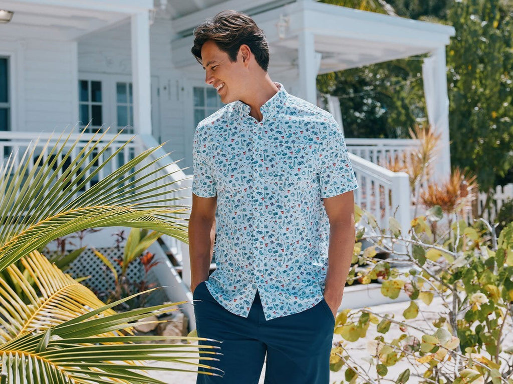 Man wearing printed short sleeve button down shirt at the beach.