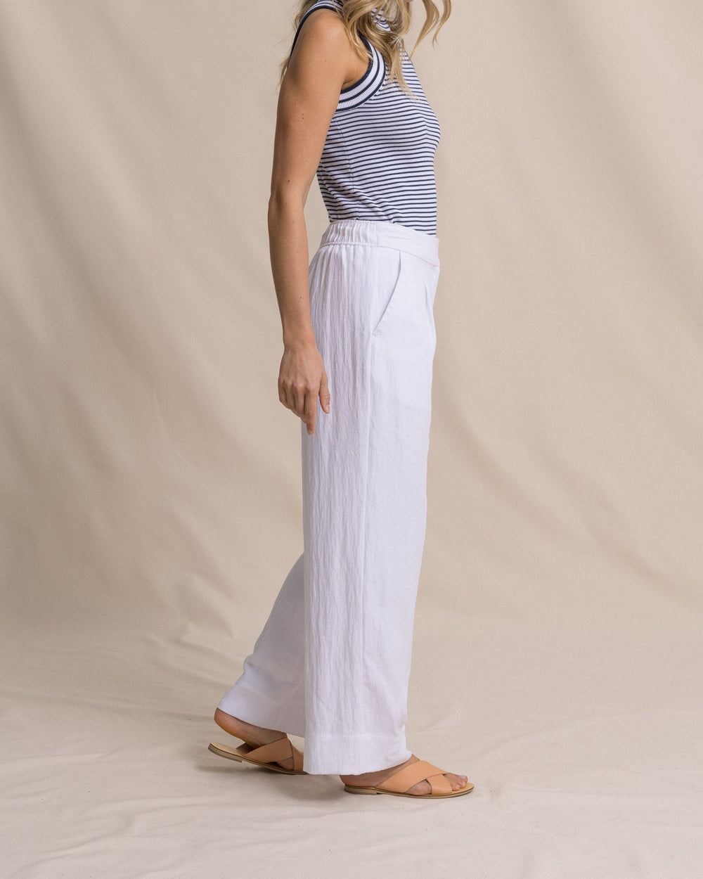 The side view of the Southern Tide Addilyn Belted Wide Leg Pants by Southern Tide - Classic White