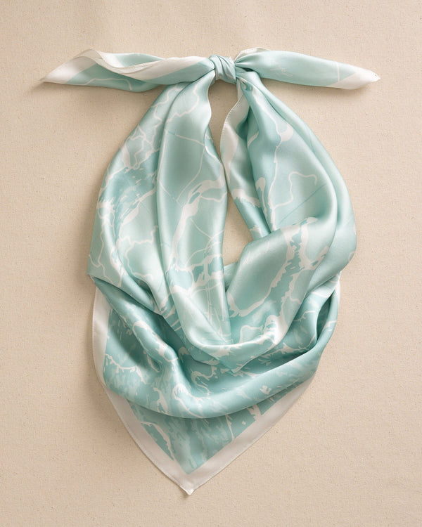The front view of the Southern Tide Swells Aerial Map Scarf by Southern Tide - Teal