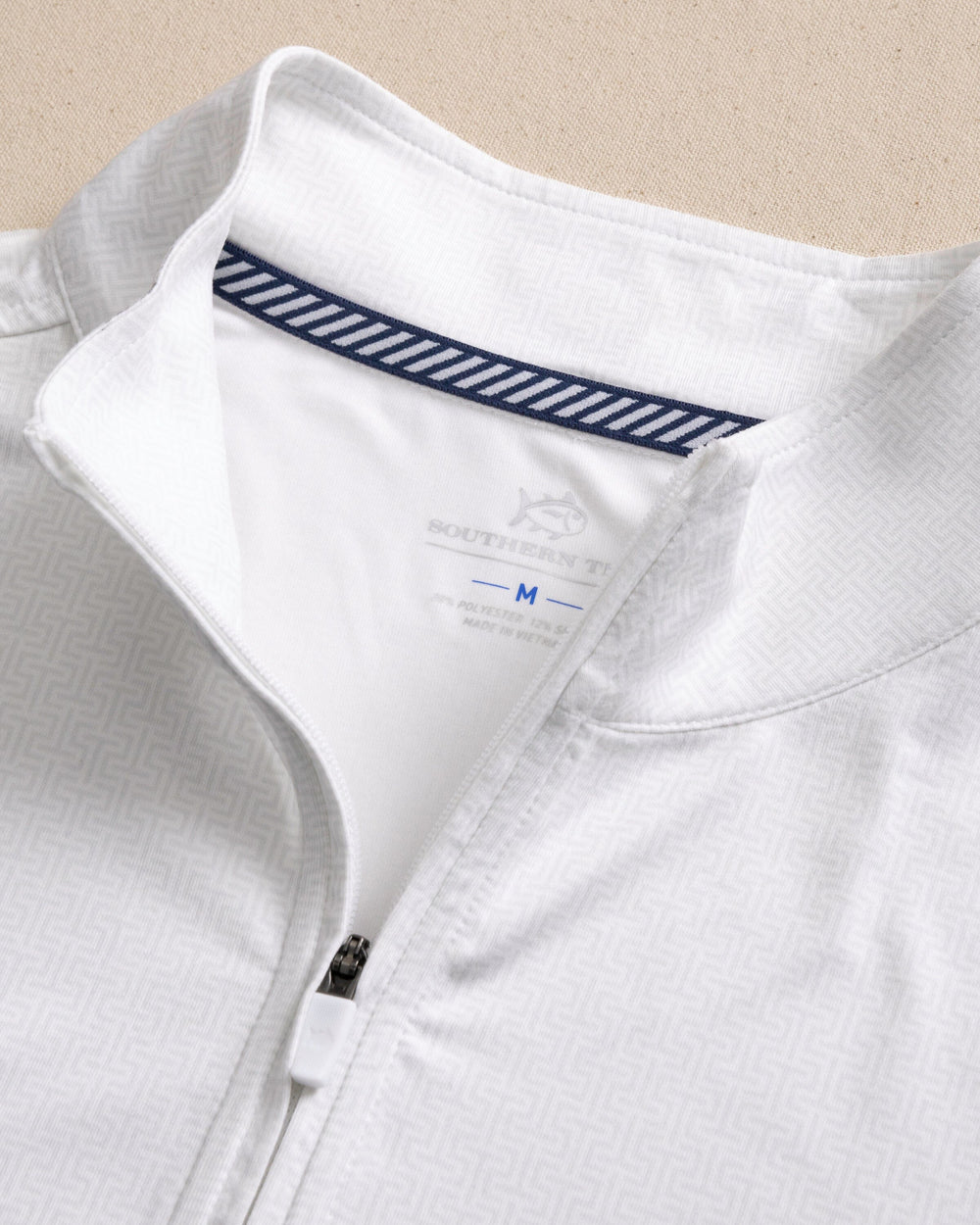 The detail view of the Southern Tide Alabama Crimson Tide Cruiser ST Geo Printed Quarter Zip by Southern Tide - Classic White