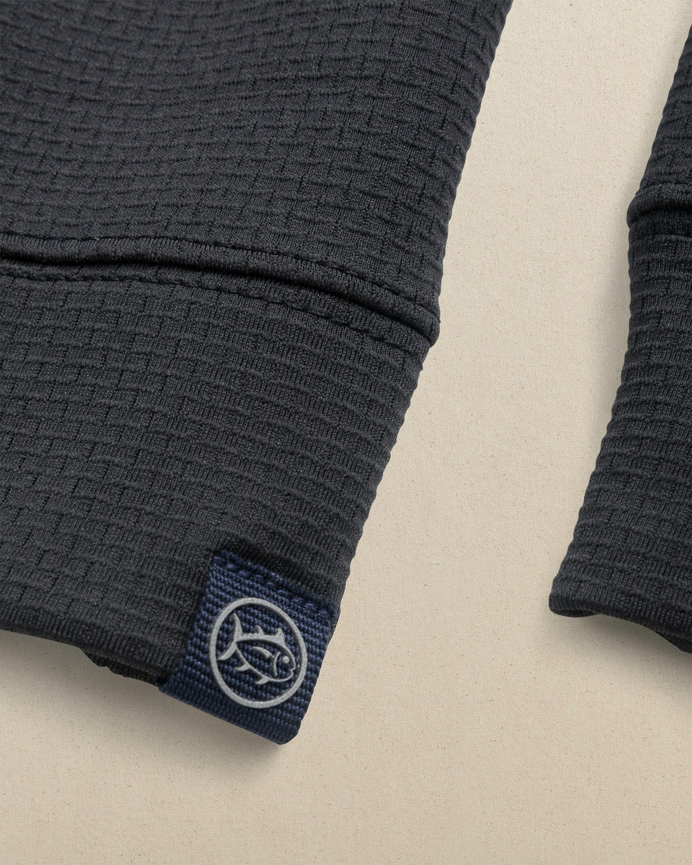 The detail view of the Southern Tide Alabama Crimson Tide Schooner Quarter Zip by Southern Tide - Caviar Black