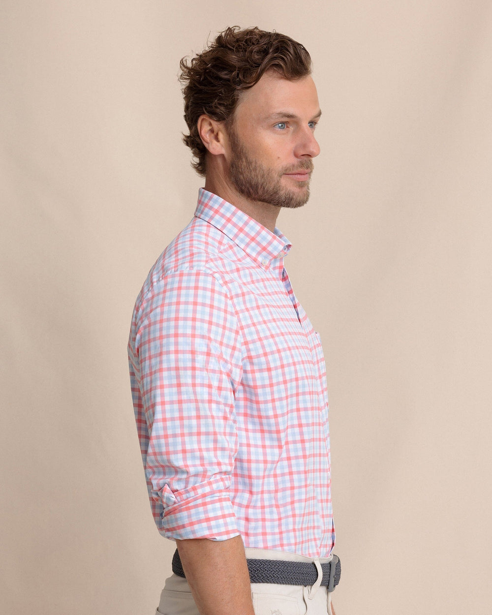 The side view of the Southern Tide Albemarle Gingham brrr°® Intercoastal Sport Shirt by Southern Tide - Sunkist Coral