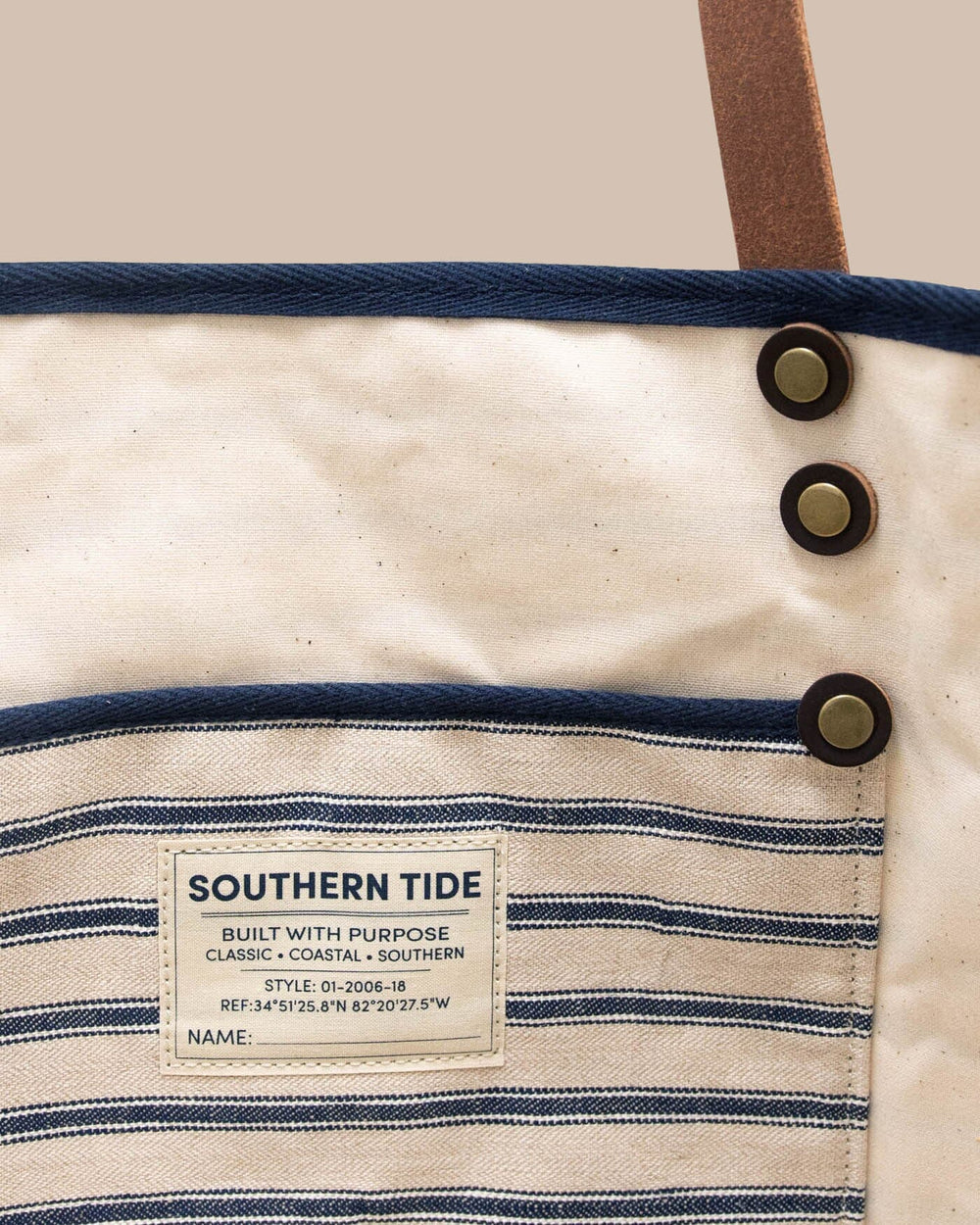 The deatil view of the All Day Stripe Tote by Southern Tide - Navy