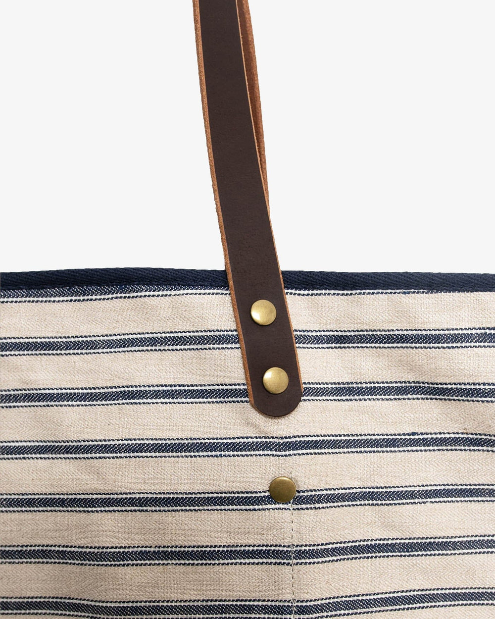 The deatil view of the All Day Stripe Tote by Southern Tide - Navy