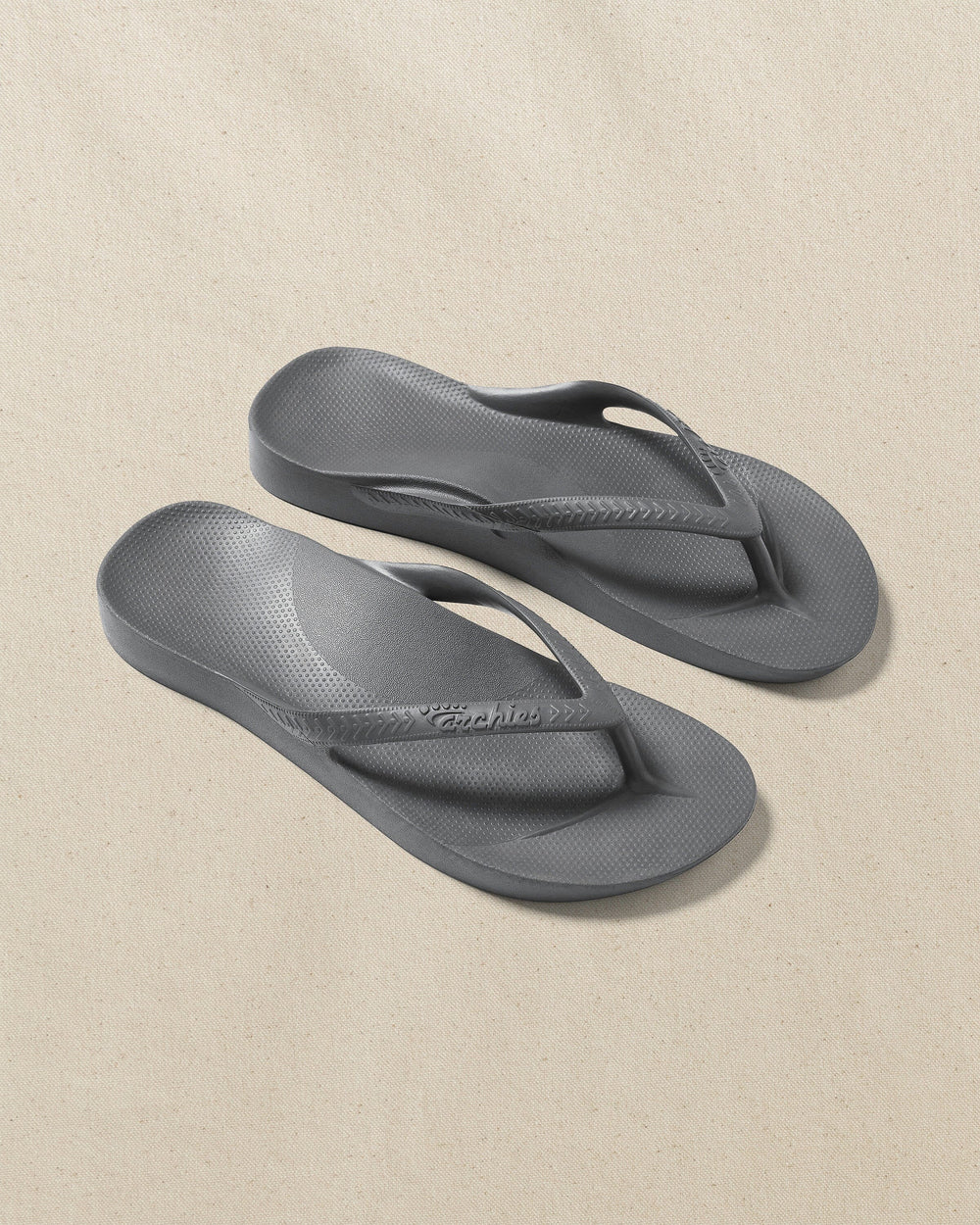 The front view of the Southern Tide Archie's Charcoal Arch Support Flip Flop by Southern Tide - Charcoal