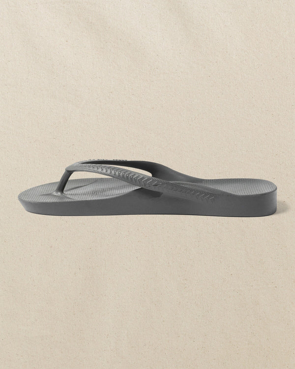 The left side view of the Southern Tide Archie's Charcoal Arch Support Flip Flop by Southern Tide - Charcoal