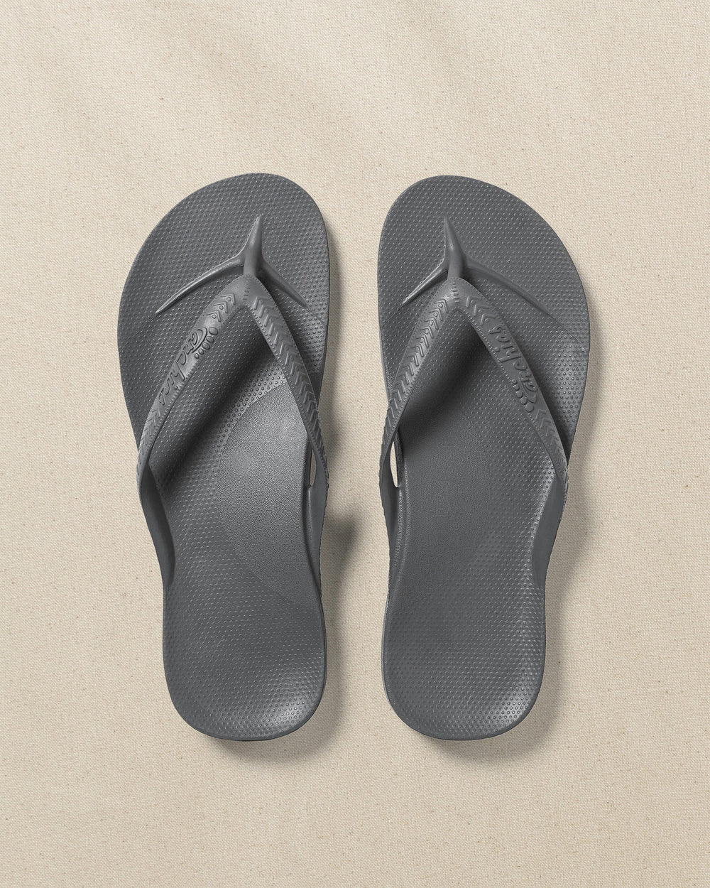The top view of the Southern Tide Archie's Charcoal Arch Support Flip Flop by Southern Tide - Charcoal