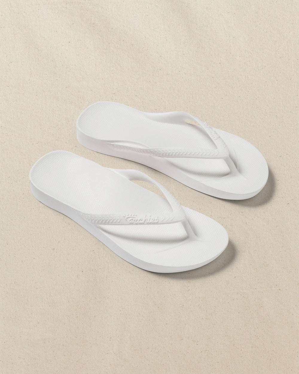 The front view of the Southern Tide Archies Classic White Arch Support Flip Flop by Southern Tide - Classic White