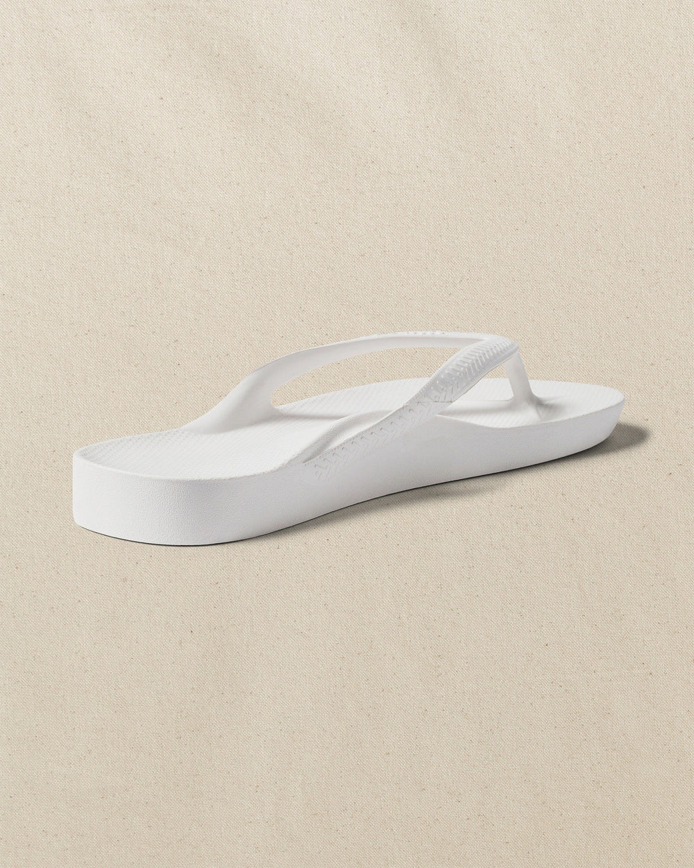 The right back view of the Southern Tide Archies Classic White Arch Support Flip Flop by Southern Tide - Classic White