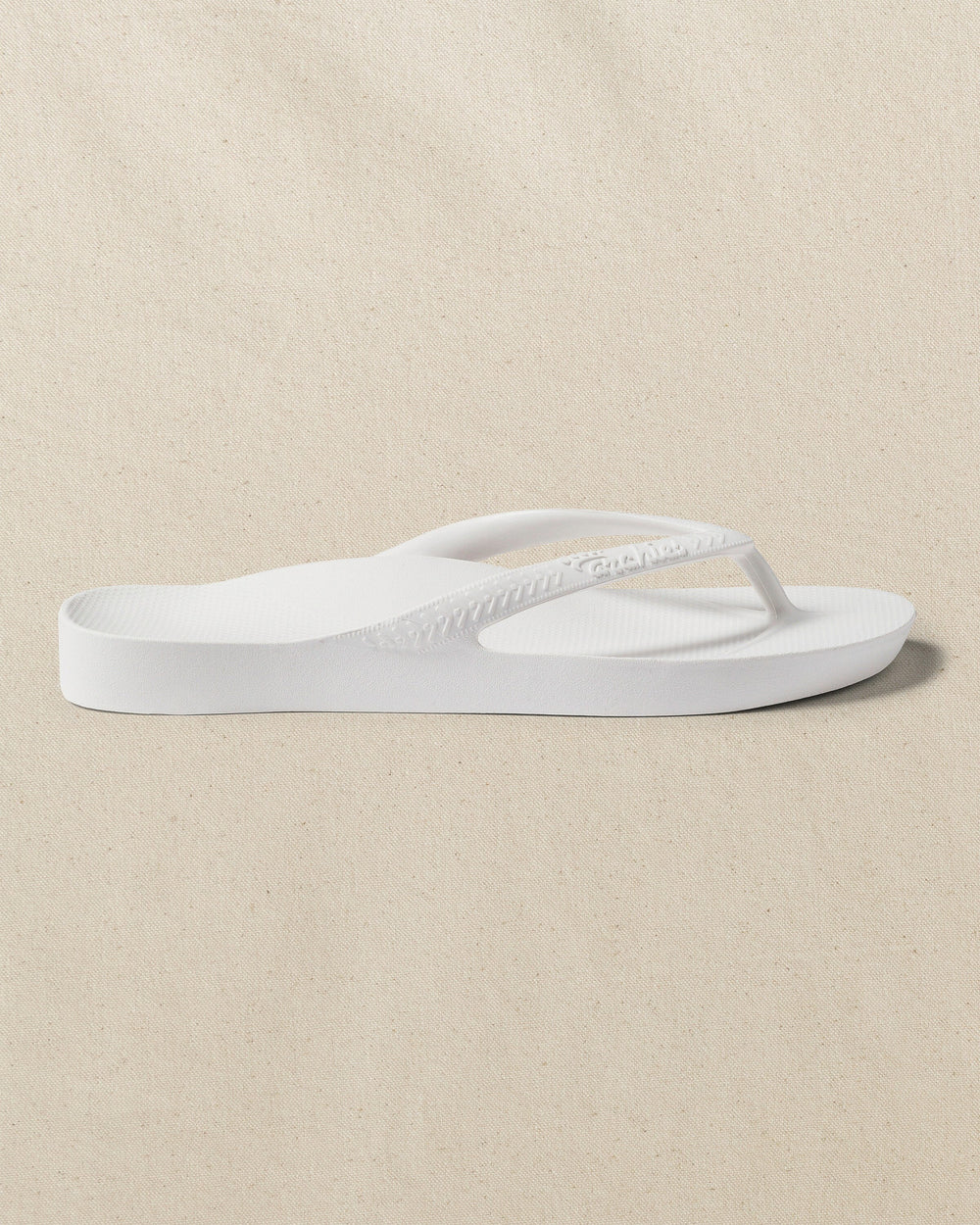 The right side view of the Southern Tide Archies Classic White Arch Support Flip Flop by Southern Tide - Classic White
