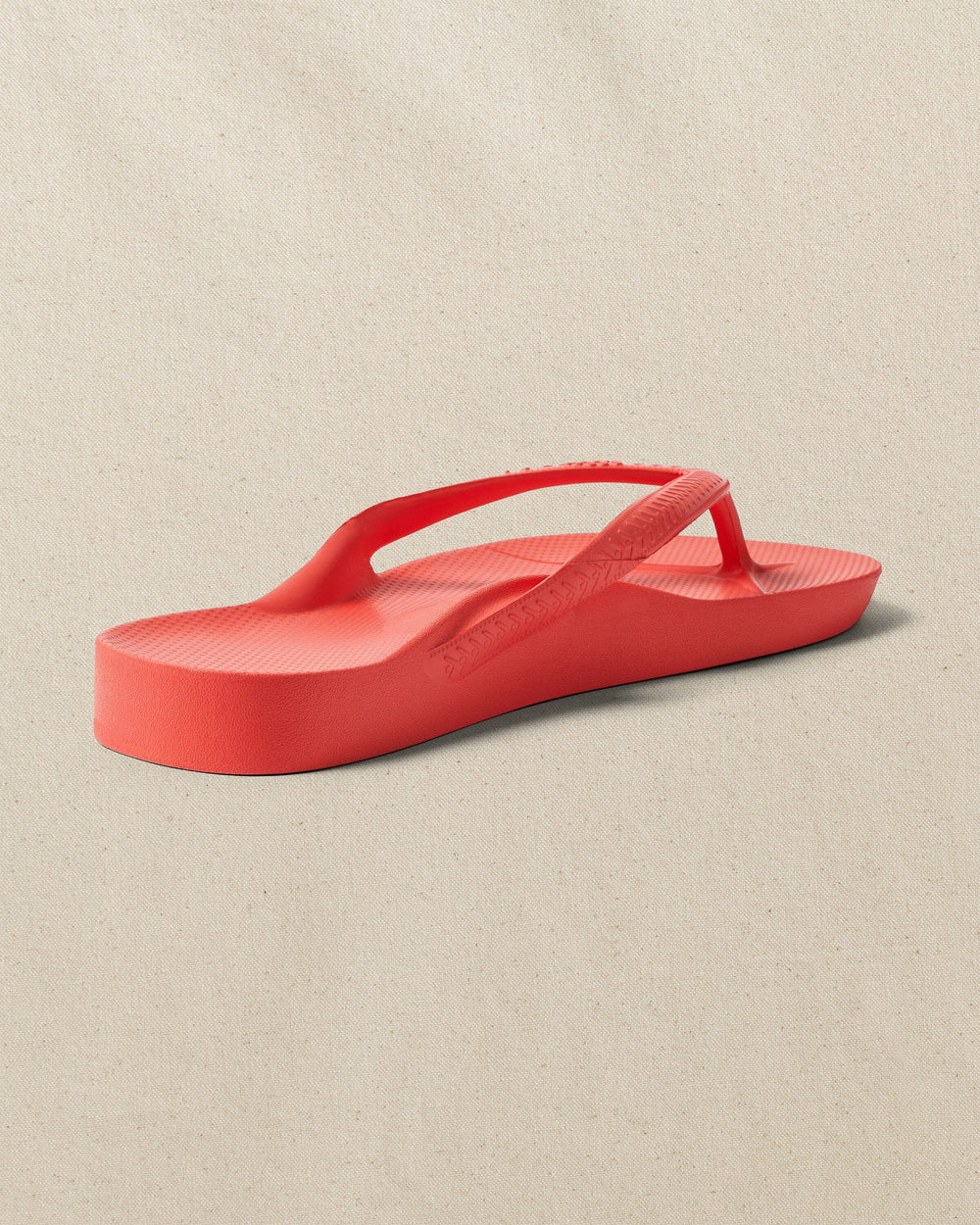 The right back view of the Southern Tide Archie's Coral Arch Support Flip Flop by Southern Tide - Coral