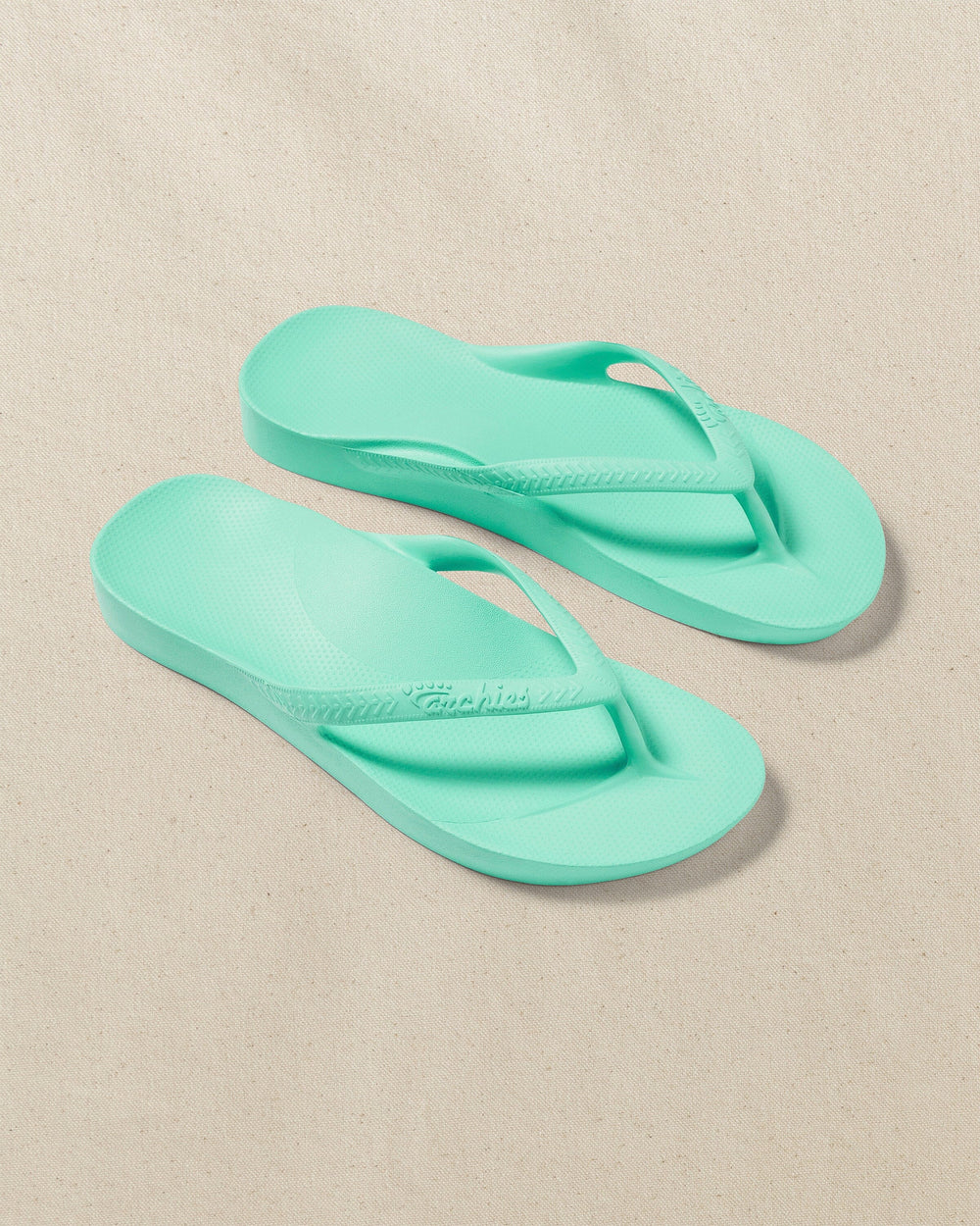 The front view of the Southern Tide Archies Mint Arch Support Flip Flop by Southern Tide - Mint