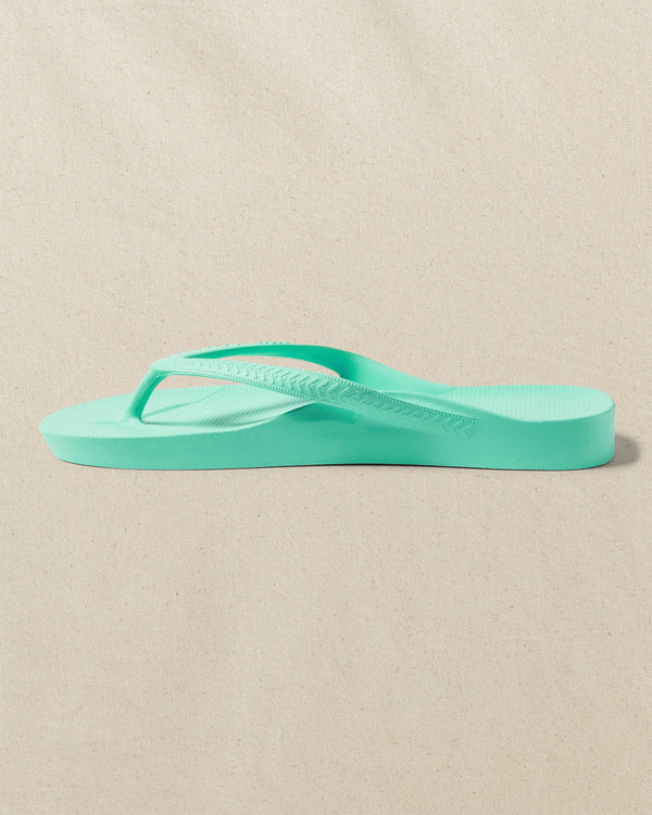 The left side view of the Southern Tide Archies Mint Arch Support Flip Flop by Southern Tide - Mint