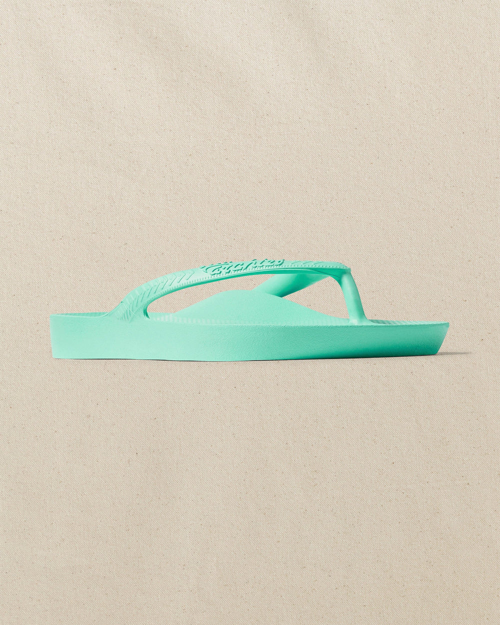 The right angle view of the Southern Tide Archies Mint Arch Support Flip Flop by Southern Tide - Mint