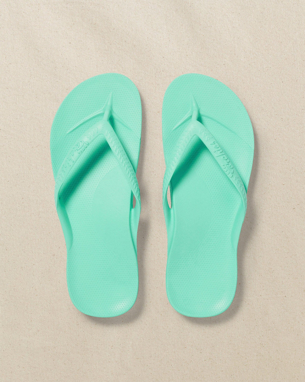 The top view of the Southern Tide Archies Mint Arch Support Flip Flop by Southern Tide - Mint