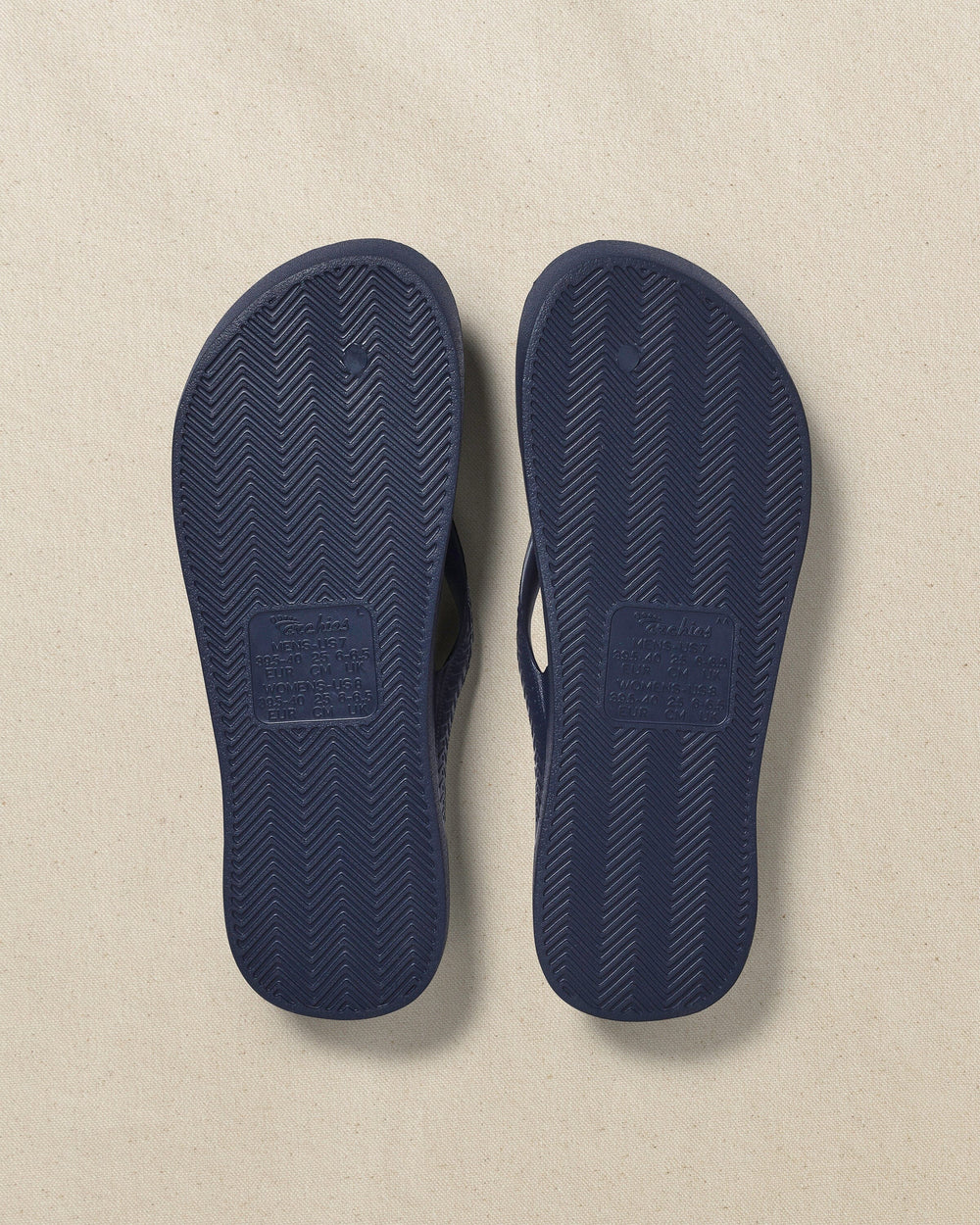 The bottom view of the Southern Tide Archie's Navy Arch Support Flip Flop by Southern Tide - Navy