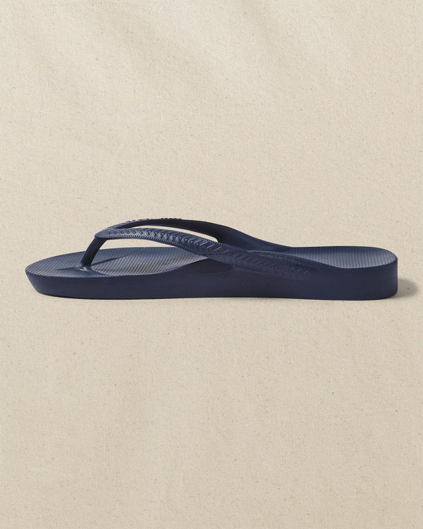 The left side view of the Southern Tide Archie's Navy Arch Support Flip Flop by Southern Tide - Navy
