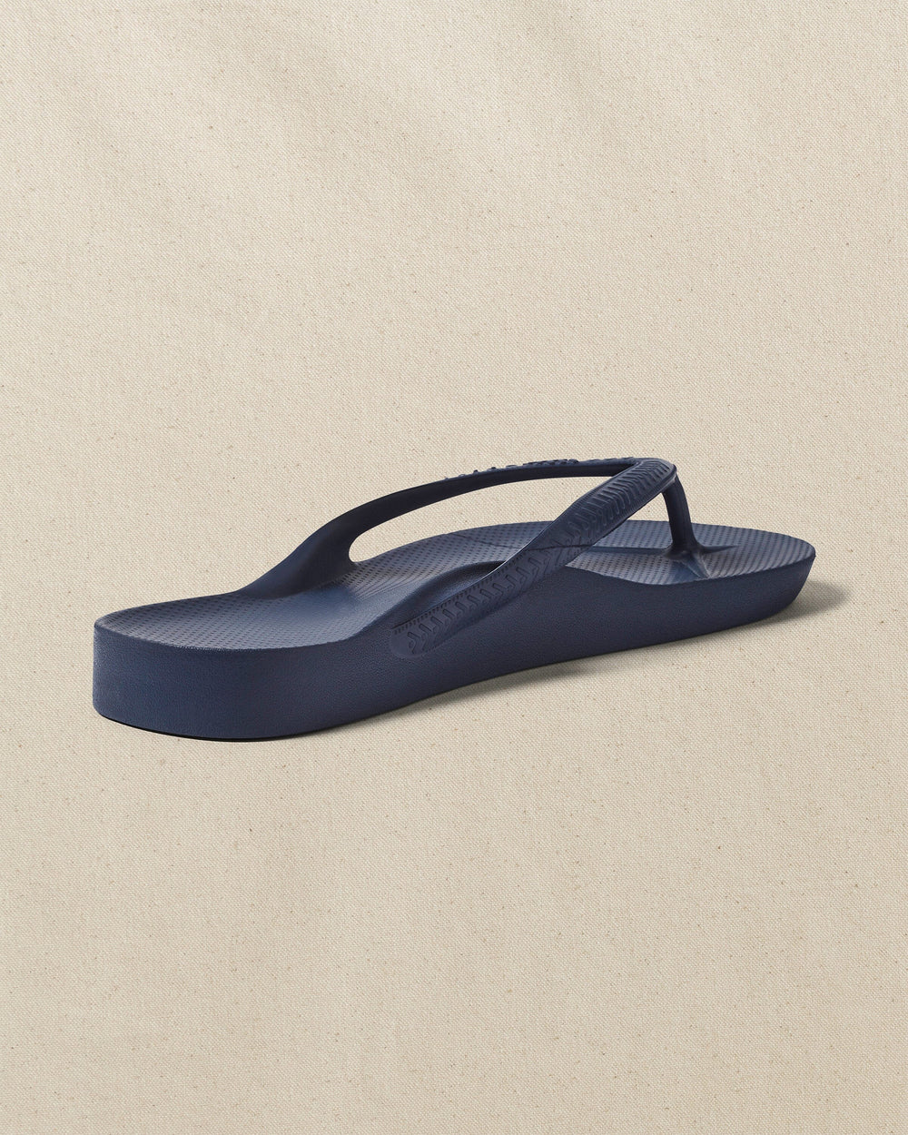 The right back view of the Southern Tide Archie's Navy Arch Support Flip Flop by Southern Tide - Navy
