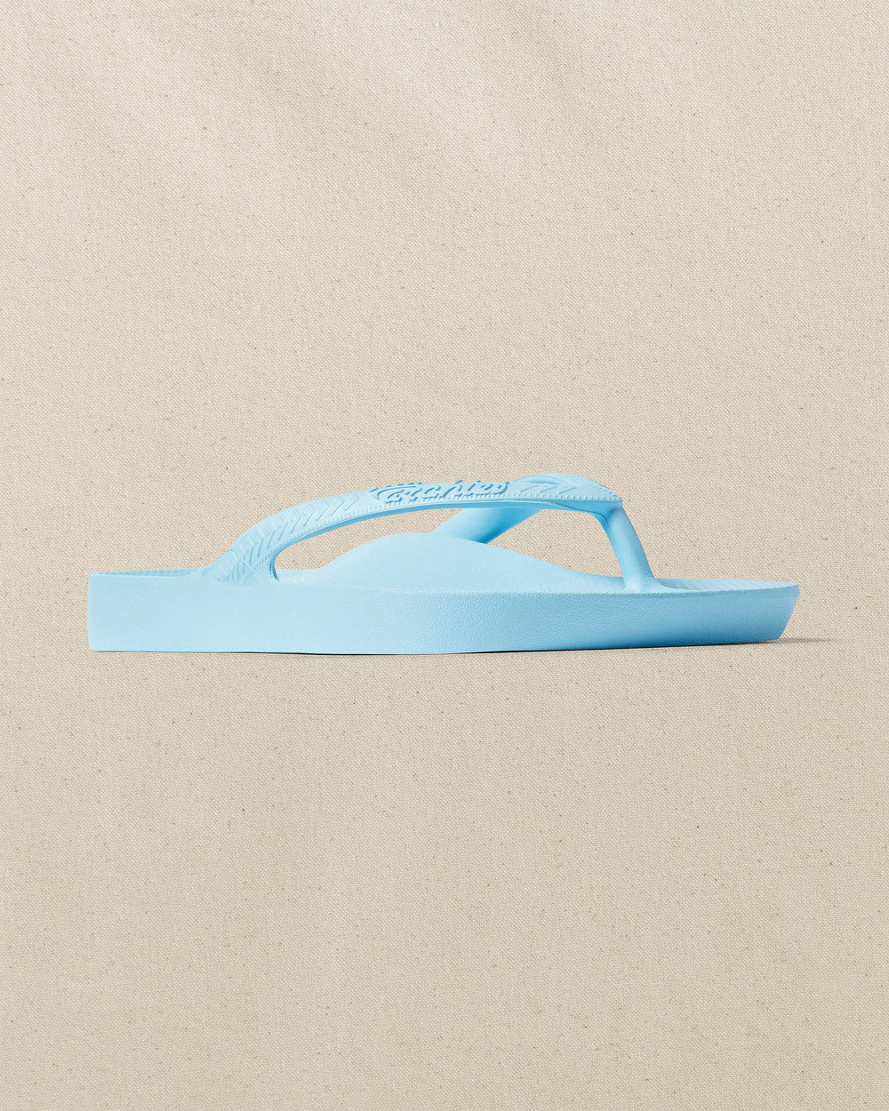 The right angle view of the Southern Tide Archie's Sky Blue Arch Support Flip Flop by Southern Tide - Sky Blue