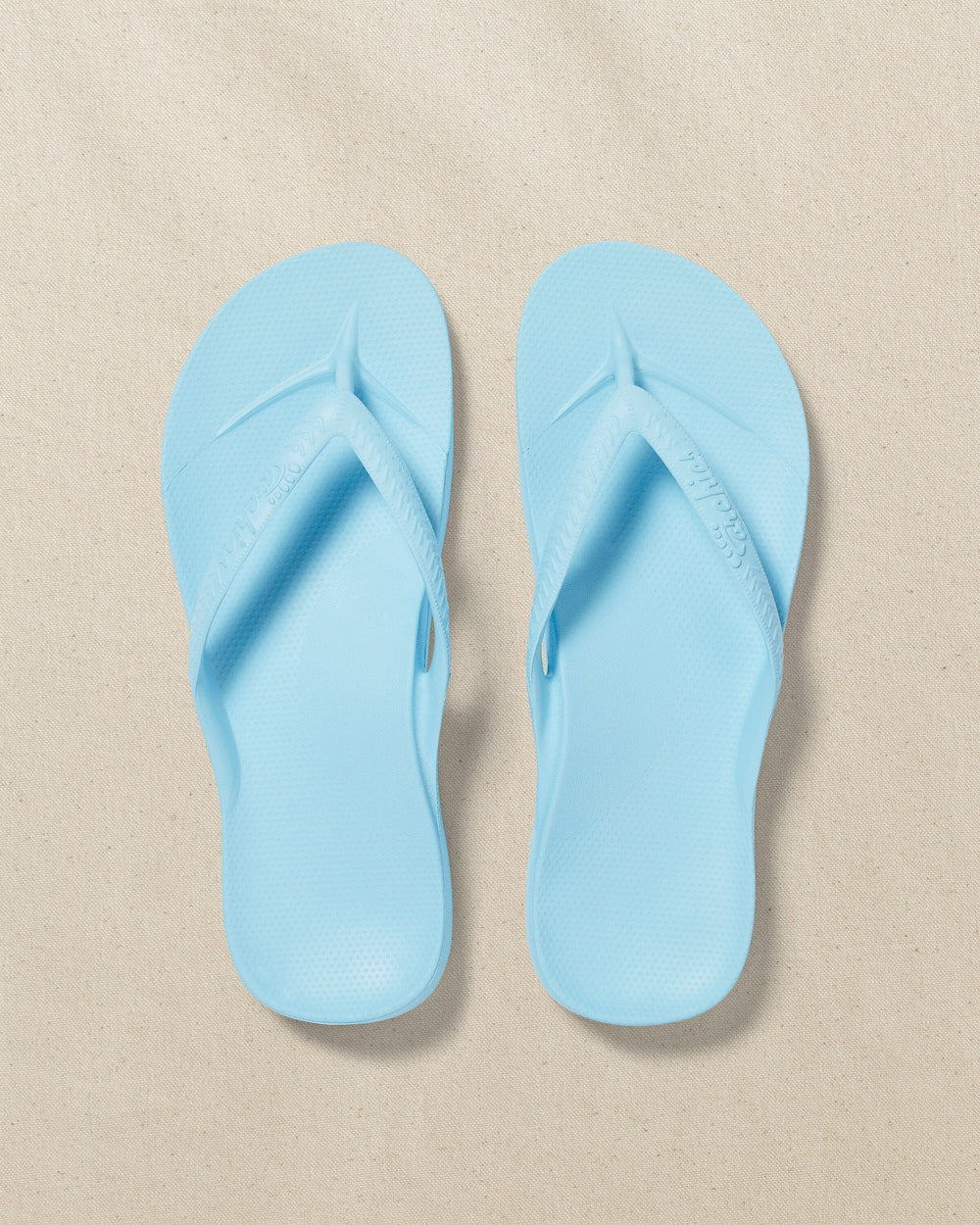 The top view of the Southern Tide Archie's Sky Blue Arch Support Flip Flop by Southern Tide - Sky Blue