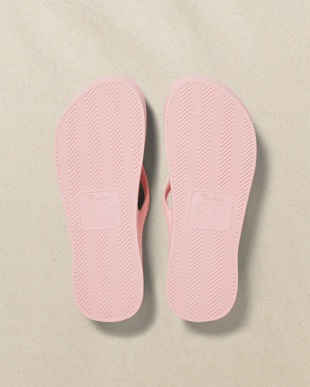 The bottom view of the Southern Tide Archie's Soft Pink Arch Support Flip Flop by Southern Tide - Soft Pink