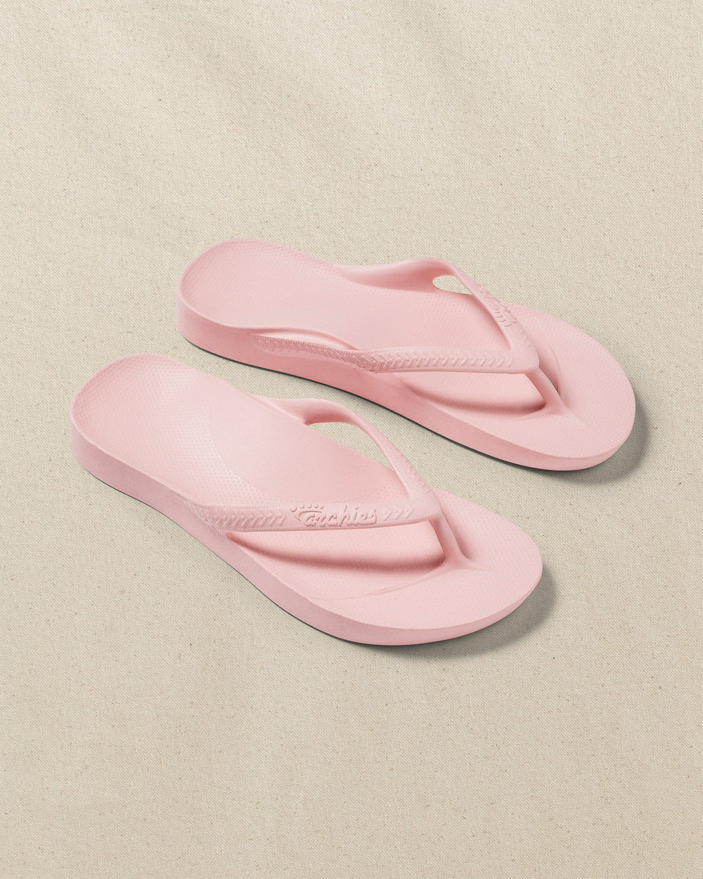The front view of the Southern Tide Archie's Soft Pink Arch Support Flip Flop by Southern Tide - Soft Pink