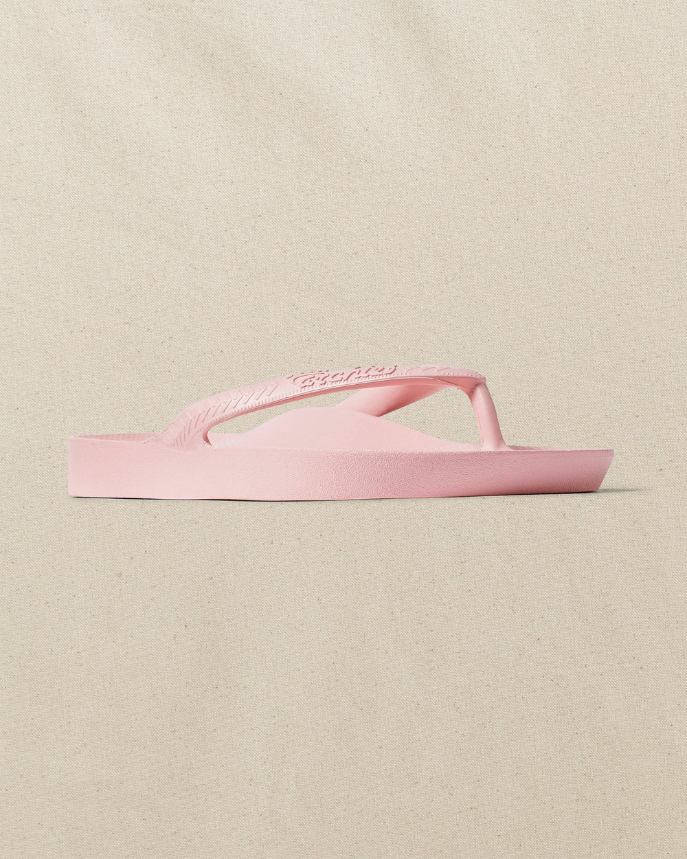 The right angle view of the Southern Tide Archie's Soft Pink Arch Support Flip Flop by Southern Tide - Soft Pink