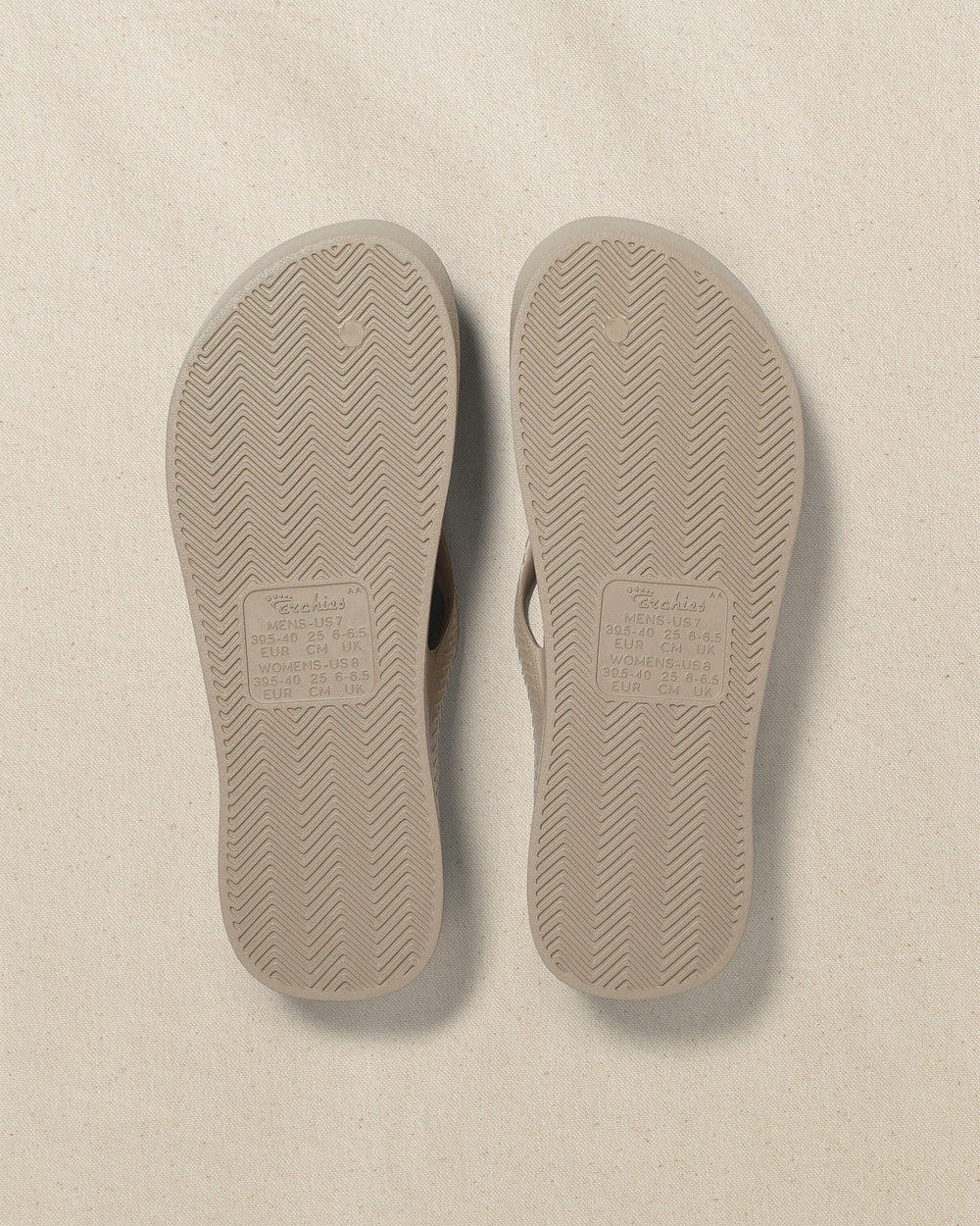 The bottom view of the Southern Tide Archie's Taupe Arch Support Flip Flop by Southern Tide - Taupe