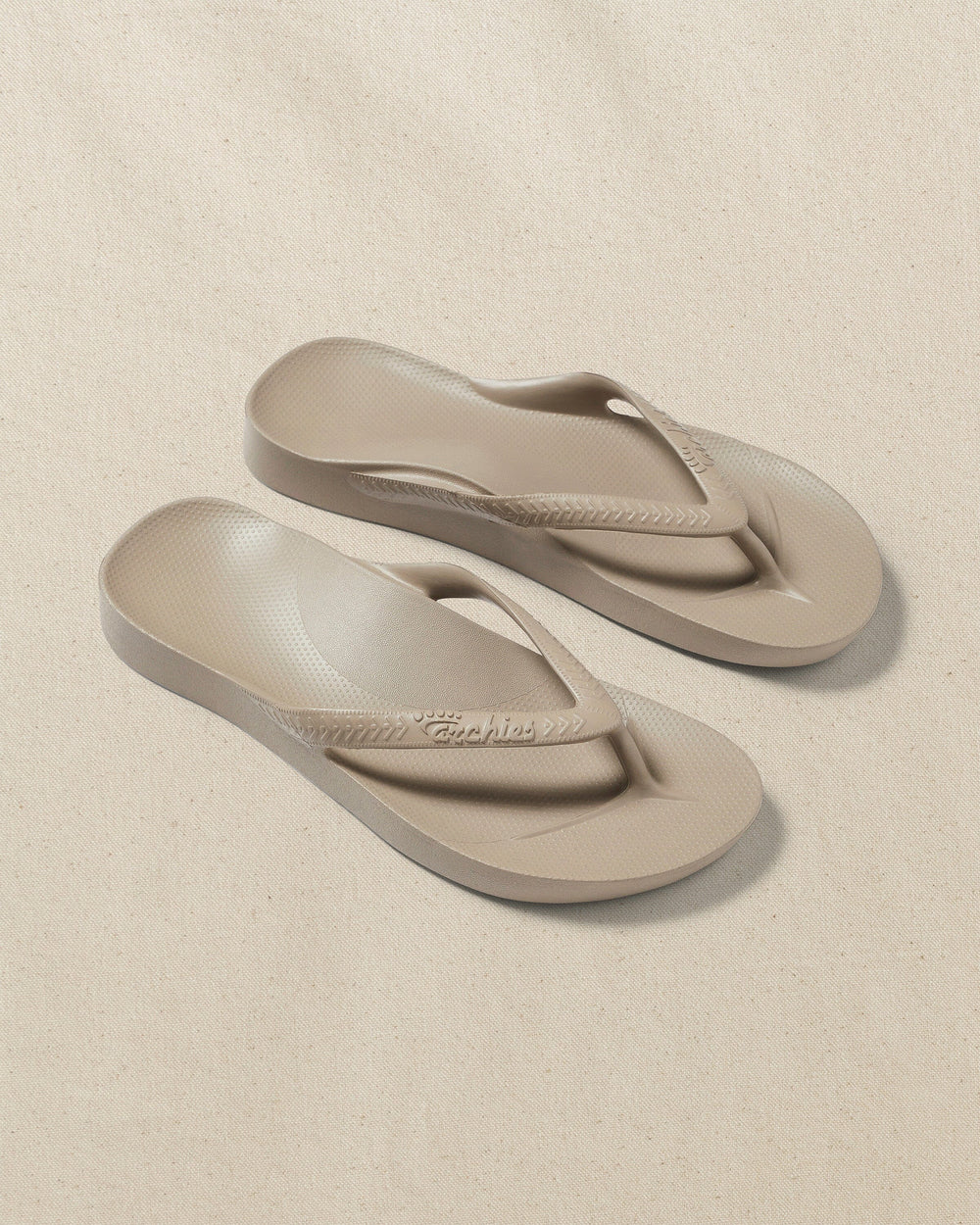 The front view of the Southern Tide Archie's Taupe Arch Support Flip Flop by Southern Tide - Taupe