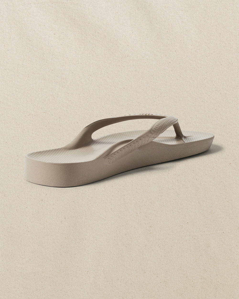 The right back view of the Southern Tide Archie's Taupe Arch Support Flip Flop by Southern Tide - Taupe