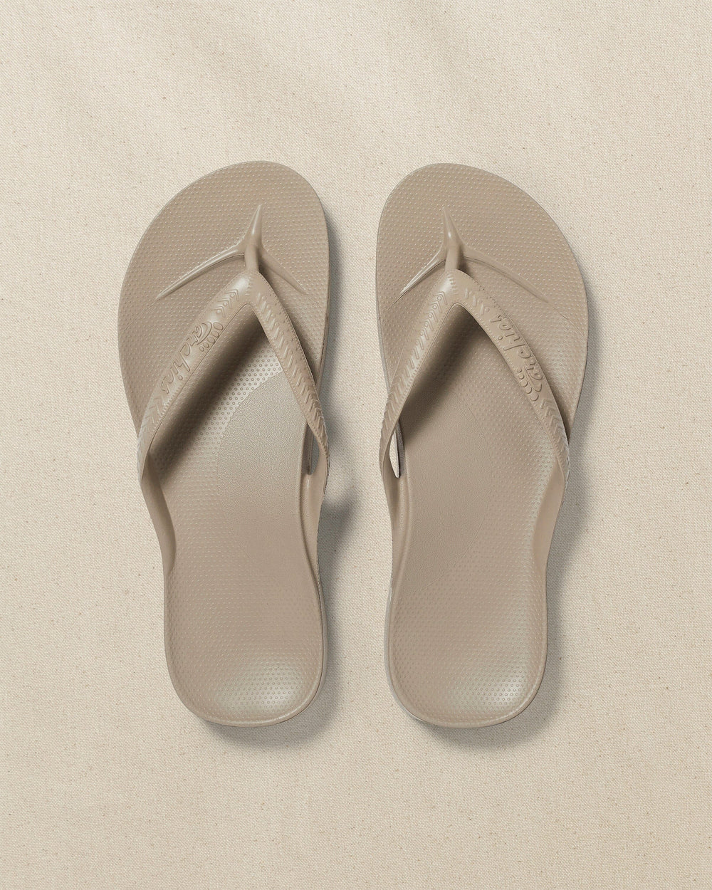 The top view of the Southern Tide Archie's Taupe Arch Support Flip Flop by Southern Tide - Taupe