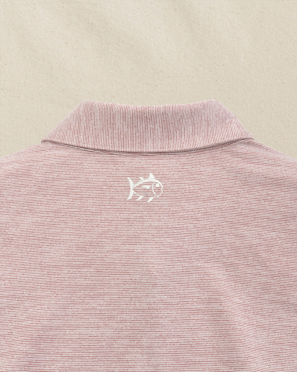 The detail view of the Southern Tide Arizona State Sun Devils Driver Spacedye Polo by Southern Tide - Chianti