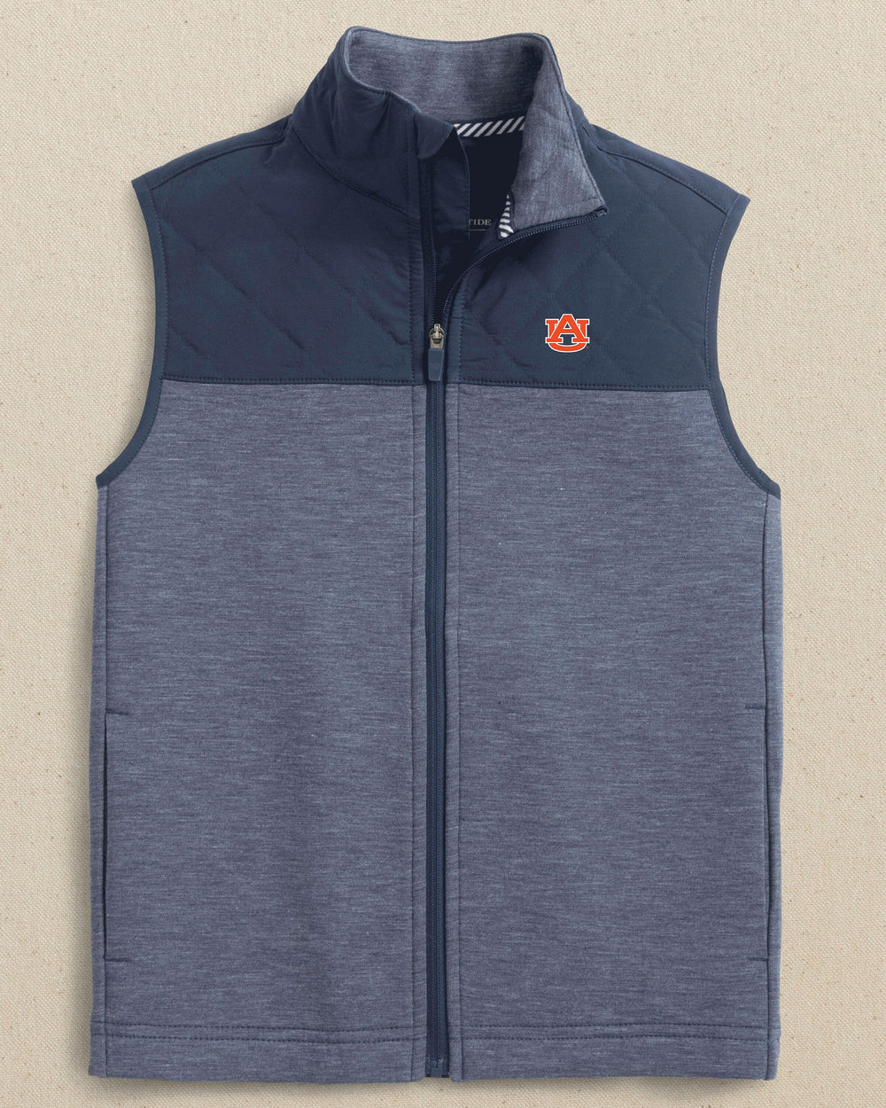 The front view of the Southern Tide Auburn Tigers Boys Waterfront Quilted Vest by Southern Tide - Dress  Blue