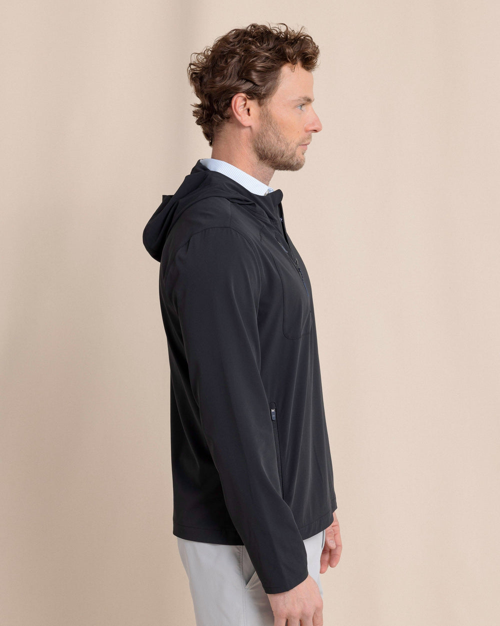 The side view of the Southern Tide Avondale Performance Jacket by Southern Tide - Caviar Black