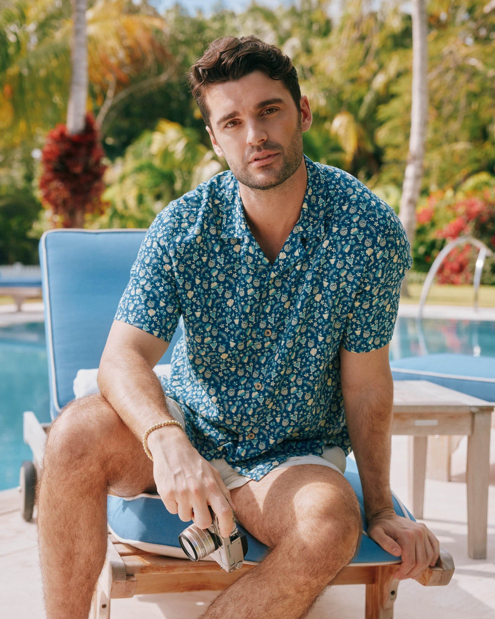 The lifestyle view of the Southern Tide Bad and Boozy Camp Short Sleeve Button Down Sport Shirt by Southern Tide - Aged Denim