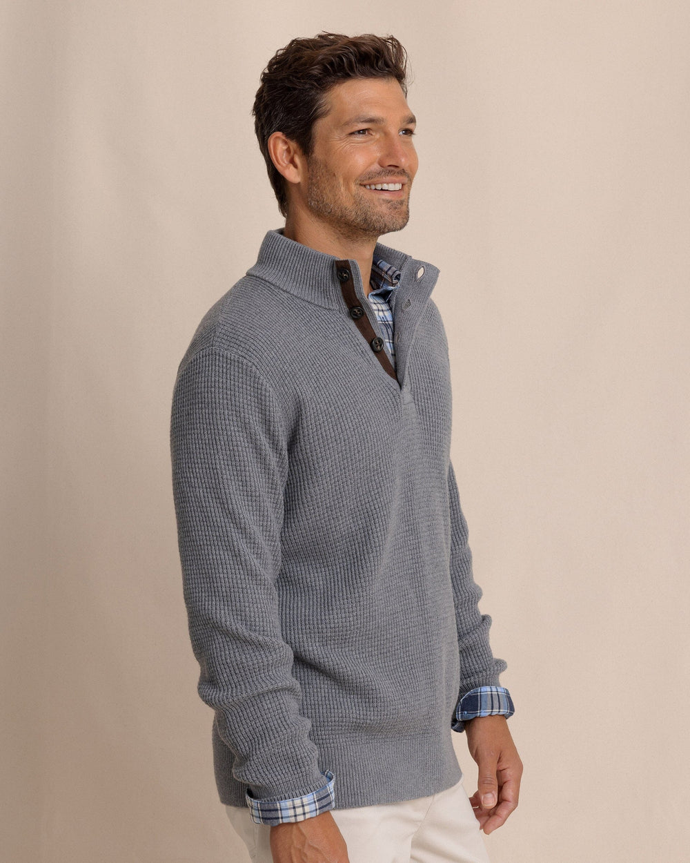 The side view of the Southern Tide Bass Creek Heather Quarter Button Sweater by Southern Tide - Heather Anchor Grey