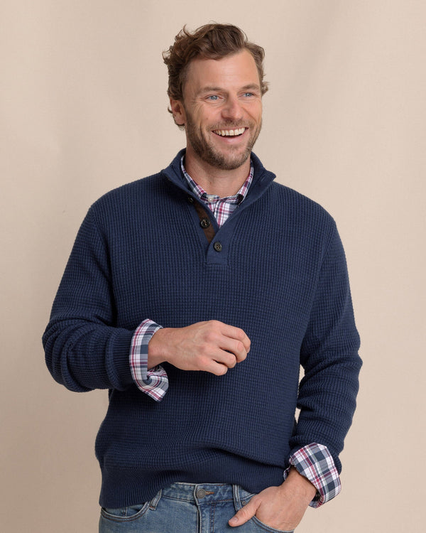 The front view of the Southern Tide Bass Creek Heather Quarter Button Sweater by Southern Tide - Heather Dress Blue