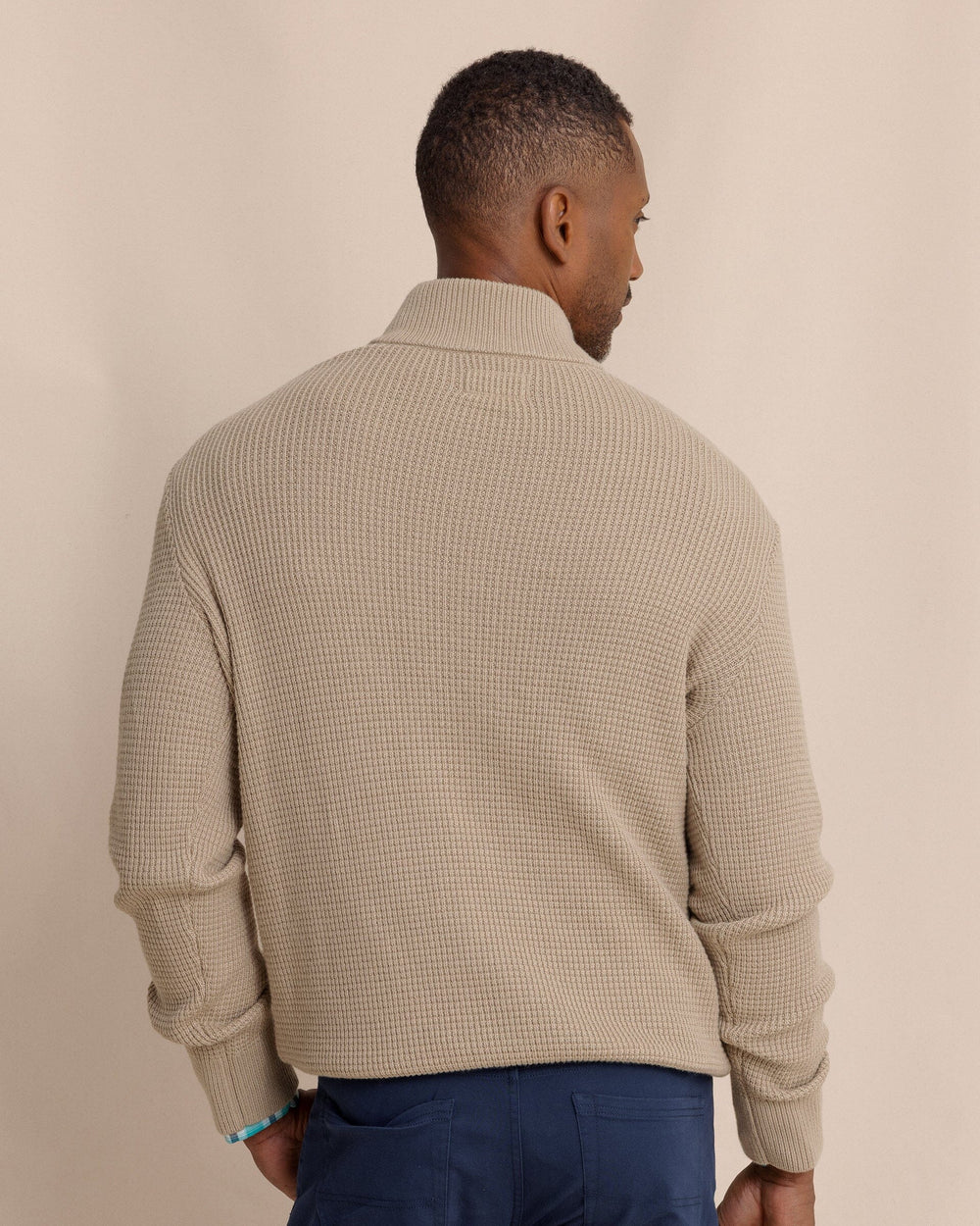 The back view of the Southern Tide Bass Creek Heather Quarter Button Sweater by Southern Tide - Heather Sandstone Khaki