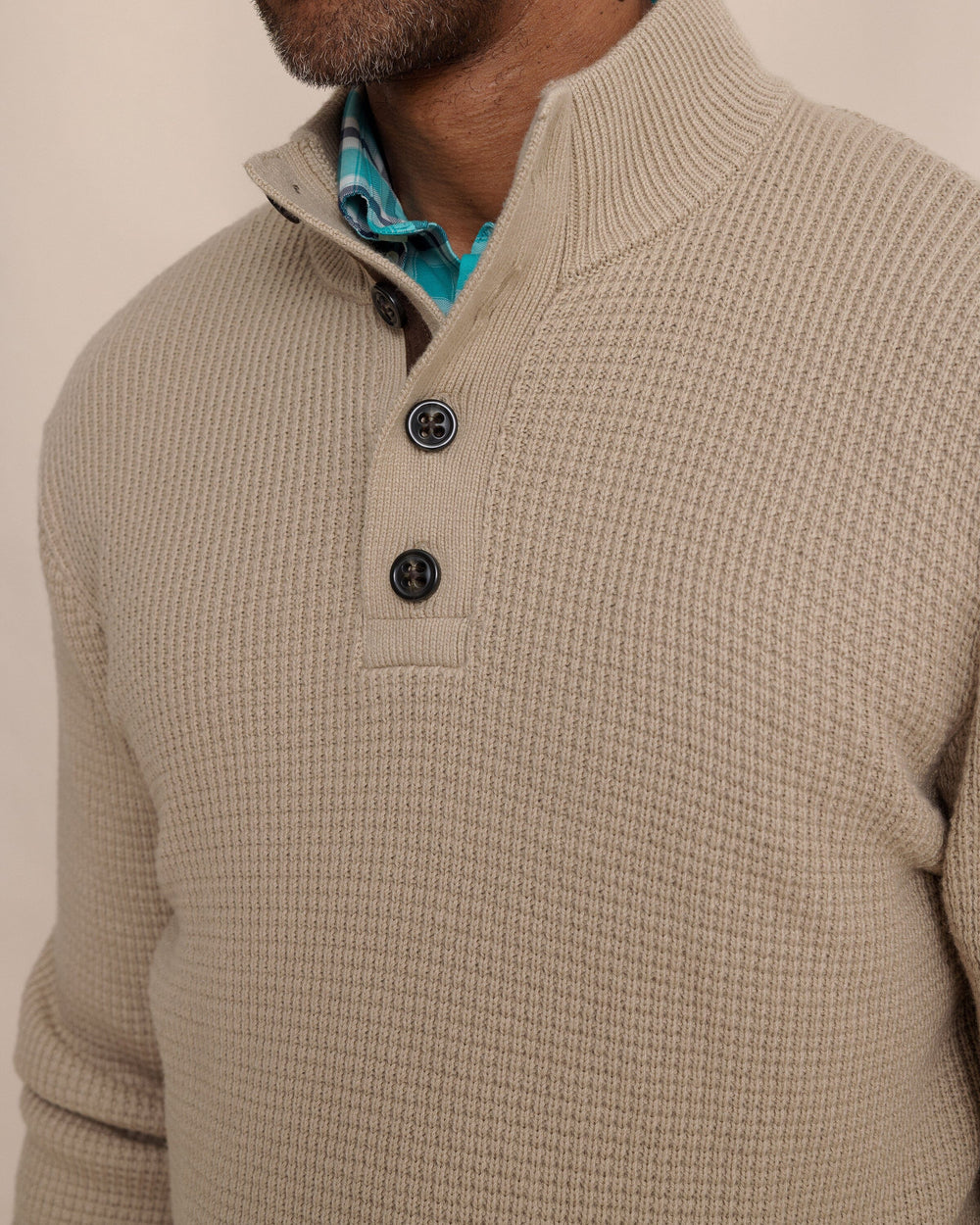 The detail view of the Southern Tide Bass Creek Heather Quarter Button Sweater by Southern Tide - Heather Sandstone Khaki