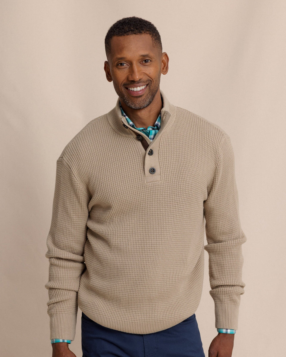 The front view of the Southern Tide Bass Creek Heather Quarter Button Sweater by Southern Tide - Heather Sandstone Khaki